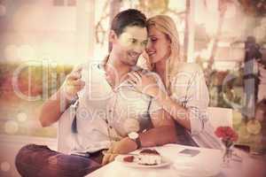 Hip young couple enjoying coffee and desert together