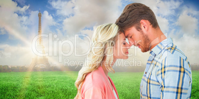 Composite image of attractive couple standing touching heads