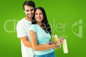 Composite image of happy young couple painting together