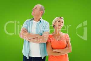 Composite image of thinking older couple with arms crossed