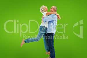 Composite image of mature couple hugging and having fun