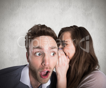 Composite image of woman whispering secret into friends ear