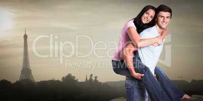 Composite image of young man giving girlfriend a piggyback ride