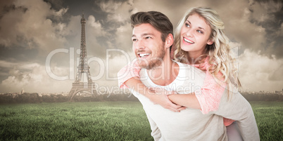 Composite image of handsome man giving piggy back to his girlfri