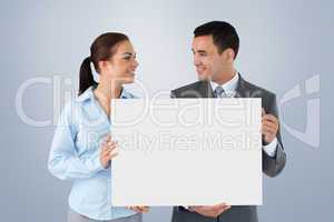 Composite image of young business partners presenting sign