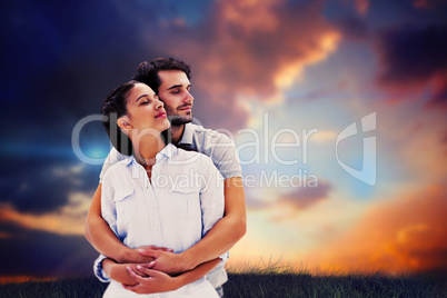 Composite image of cute couple embracing with eyes closed