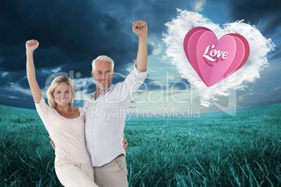 Composite image of smiling couple cheering at the camera