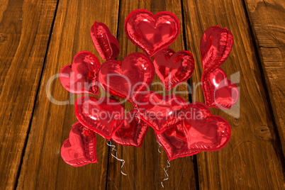 Composite image of heart balloons