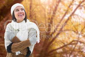 Composite image of brunette in warm clothing