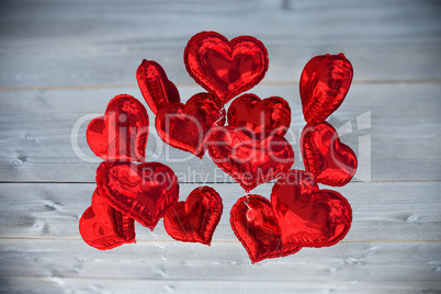 Composite image of heart balloons