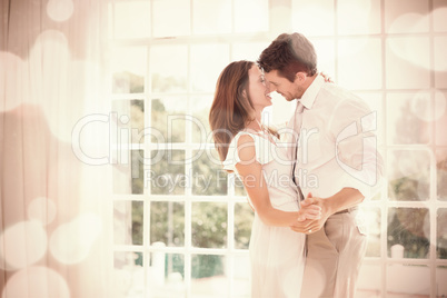 Loving young couple holding hands at home