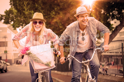 Hip young couple going for a bike ride