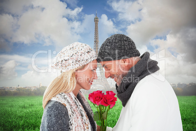 Composite image of smiling couple in winter fashion posing with