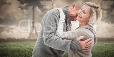 Composite image of happy mature couple in winter clothes