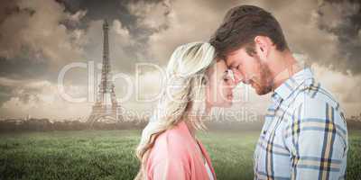 Composite image of attractive couple standing touching heads