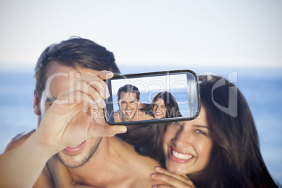 Couple taking selfie on smartphone