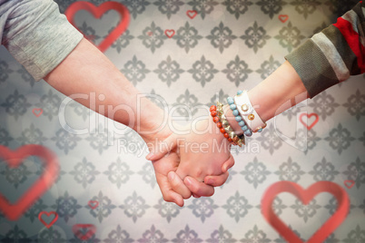 Composite image of students holding hands