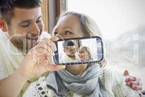 Couple taking selfie on smartphone