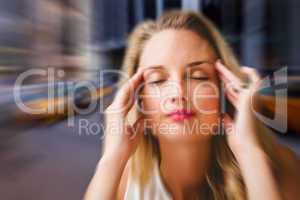 Composite image of woman with headache