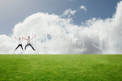 Composite image of couple jumping and holding hands