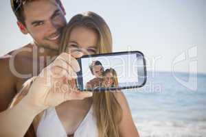 Couple taking selfie on smartphone