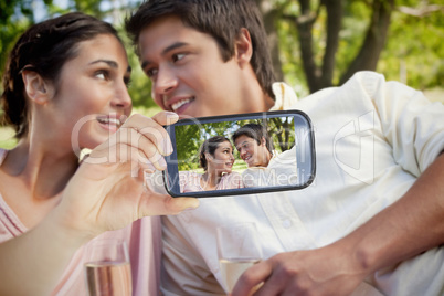 Couple taking selfie on smartphone