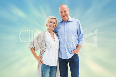 Composite image of happy mature couple hugging and smiling