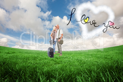 Composite image of happy couple ready to go on holiday