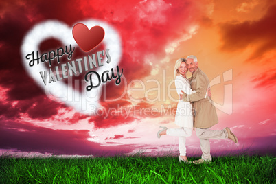 Composite image of happy couple posing in trench coats