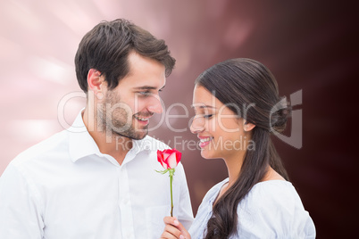 Composite image of handsome man offering his girlfriend a rose