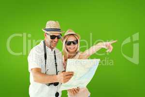 Composite image of happy tourist couple using map and pointing