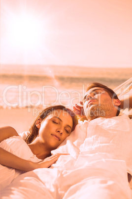 Peaceful couple sleeping in a hammock