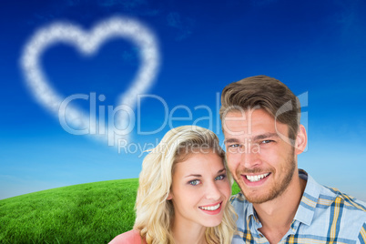 Composite image of attractive young couple smiling at camera