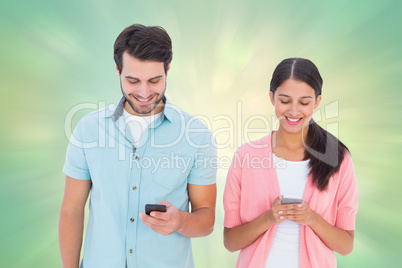 Composite image of happy couple sending text messages