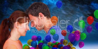 Composite image of couple looking at each other