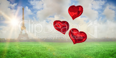 Composite image of love heart balloons