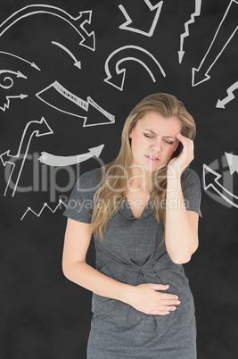 Composite image of woman with stomach ache