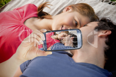Couple taking selfie on smartphone