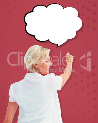 Composite image of happy mature woman writing and smiling