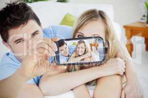 Couple taking selfie on smartphone