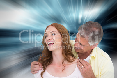 Composite image of casual couple laughing together