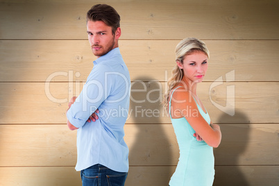 Composite image of unhappy couple not speaking to each other