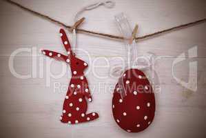 Red Easter Bunny And Easter Egg Hanging On Line With Frame