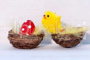 One Red Easter Egg And Yellow Chick In Nest