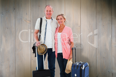 Composite image of smiling older couple going on their holidays