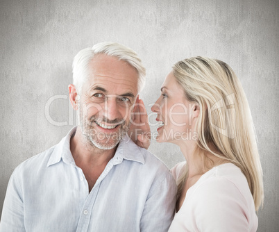 Composite image of woman whispering a secret to husband