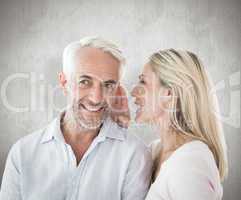 Composite image of woman whispering a secret to husband