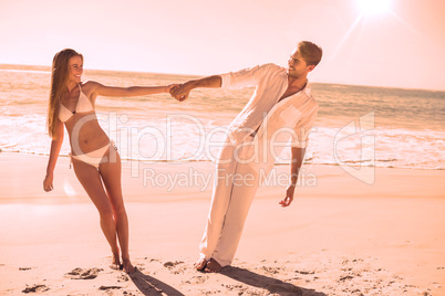 Couple holding hands and leaning to either side