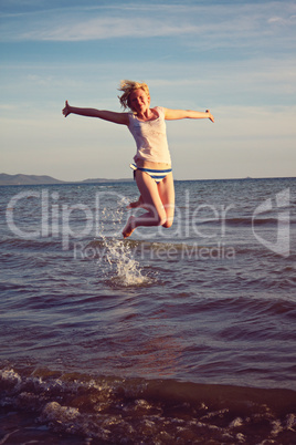 Summer holidays - jumping woman