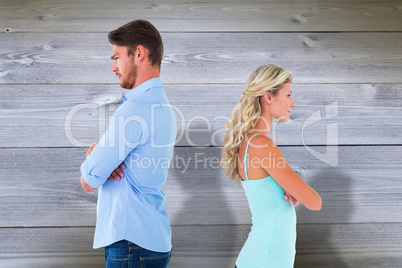 Composite image of unhappy couple not speaking to each other